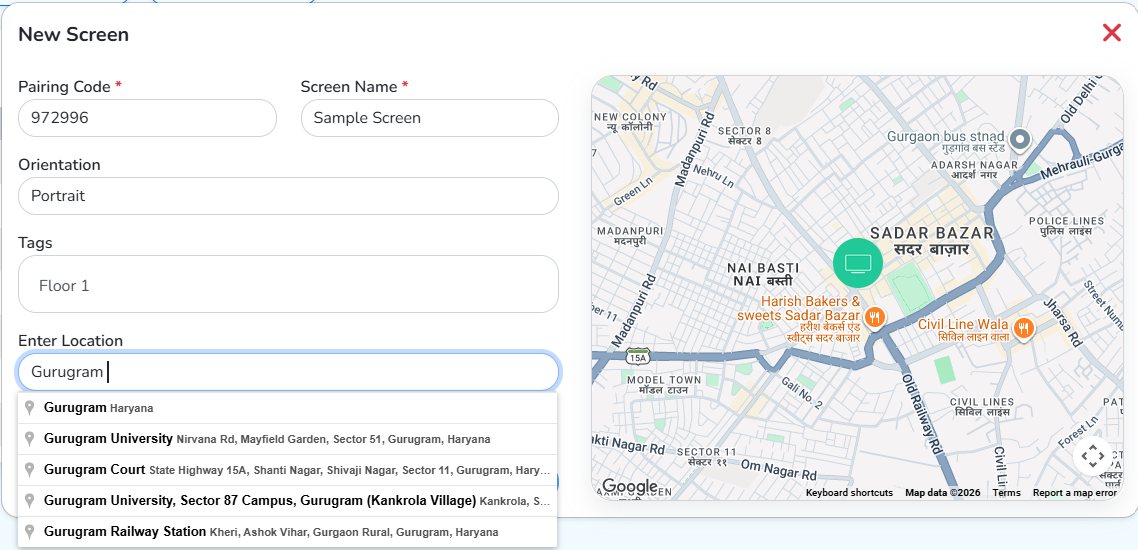 The New Screen dialog with the pairing code, screen name, orientation, tags and location filled in