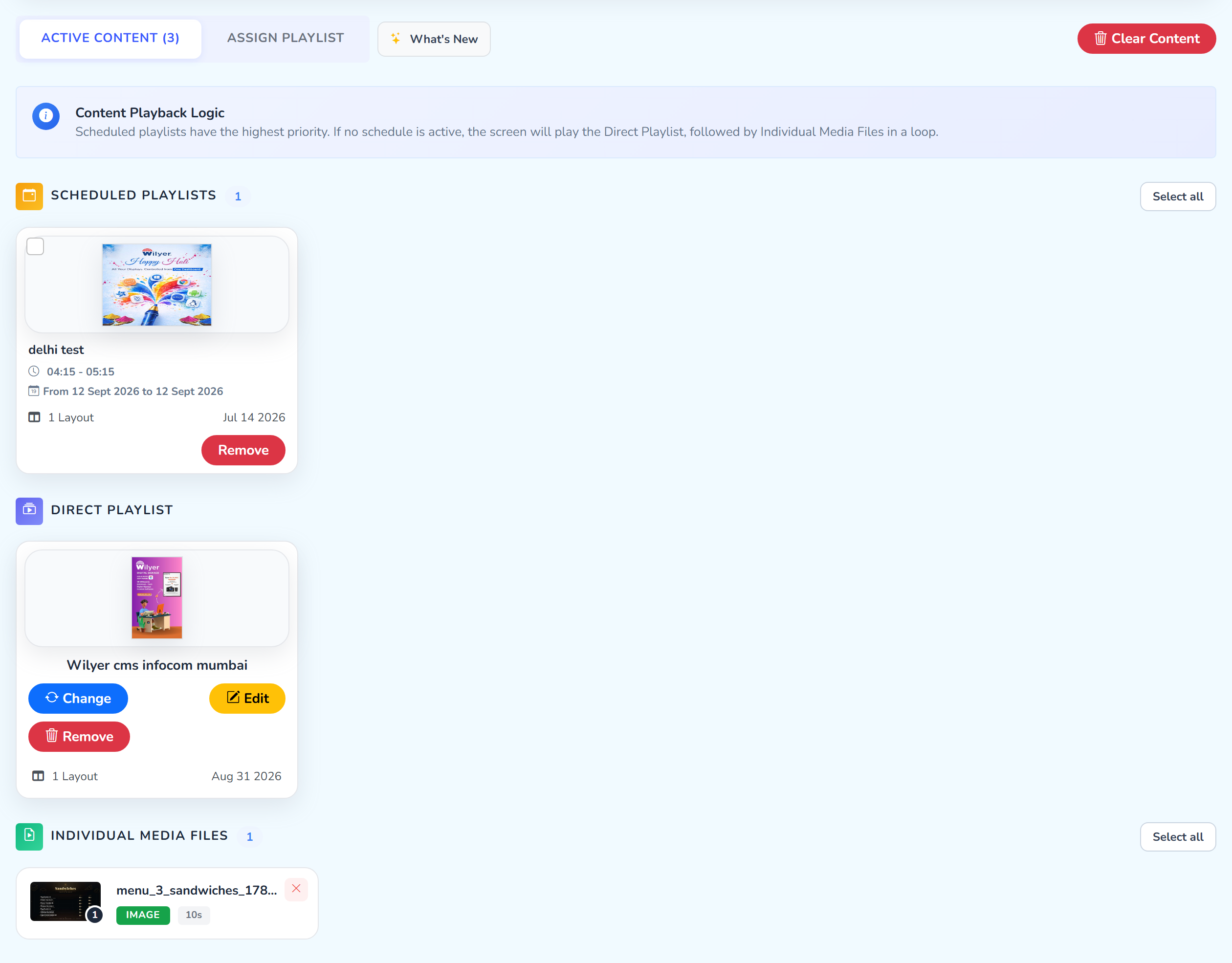 The Active Content view on Sample Screen: the ACTIVE CONTENT (3) tab and the red Clear Content button, the Content Playback Logic note, and the three sections, a scheduled delhi test playlist, the direct playlist, and one individual media file